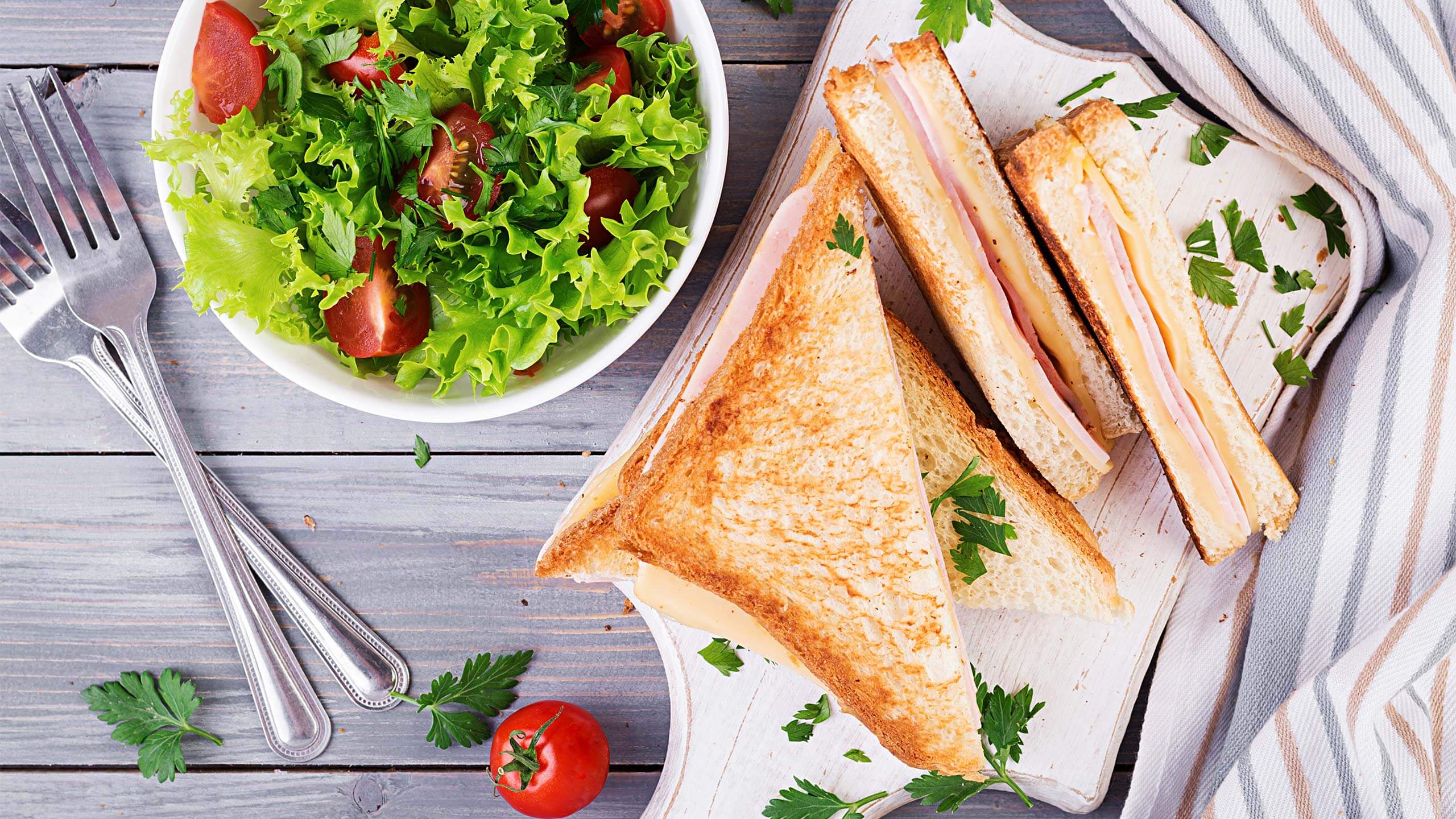 club sandwich panini with ham cheese and salad